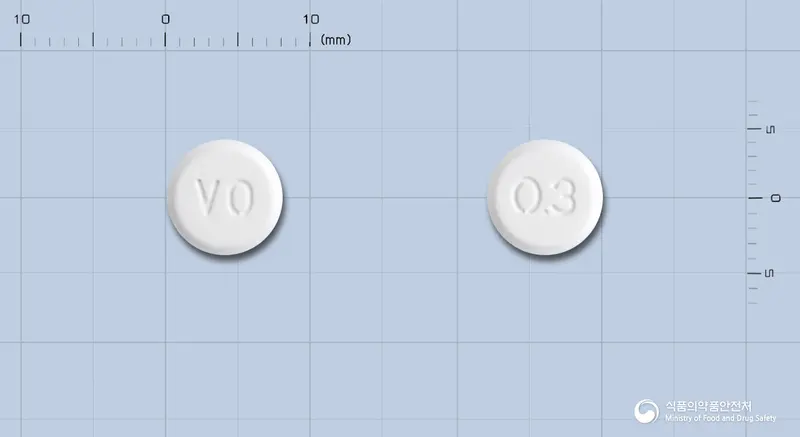 보글리아오디정0.3밀리그램(보글리보스) 앞뒤 사진 (흰색 원형, 각인 VO / 0.3)
