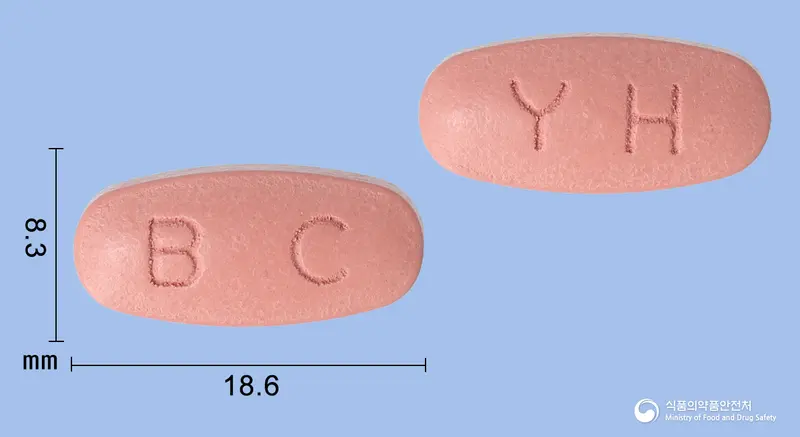 삐콤씨정 앞뒤 사진 (분홍색 타원형, 각인 BC / YH)