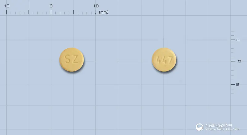 산도스아리피프라졸정15mg(아리피프라졸) 앞뒤 사진 (노란색 원형, 각인 SZ / 447)