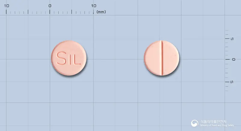 뮤토나제정 앞뒤 사진 (분홍색 원형, 각인 SIL)