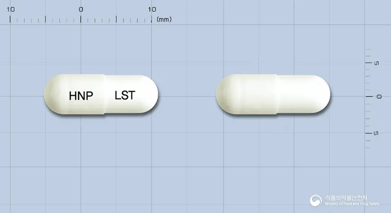 란사톤캡슐30mg(란소프라졸과립) 앞뒤 사진 (흰색 캡슐, 각인 HNP LST)