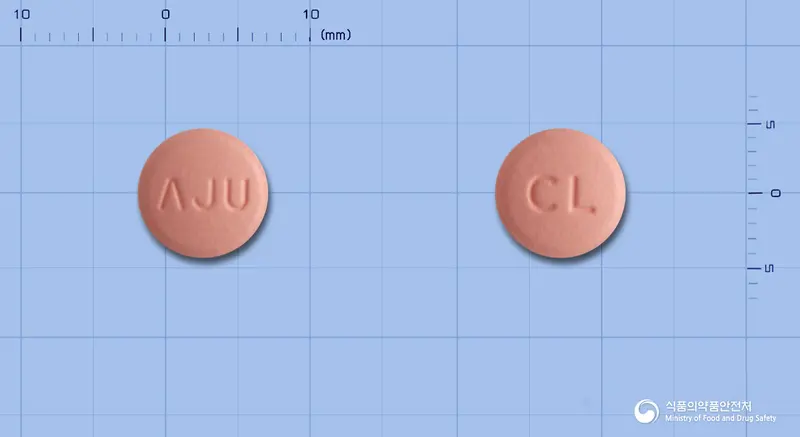 아나빅스정(클로피도그렐황산수소염) 앞뒤 사진 (분홍색 원형, 각인 ΛJU / CL)