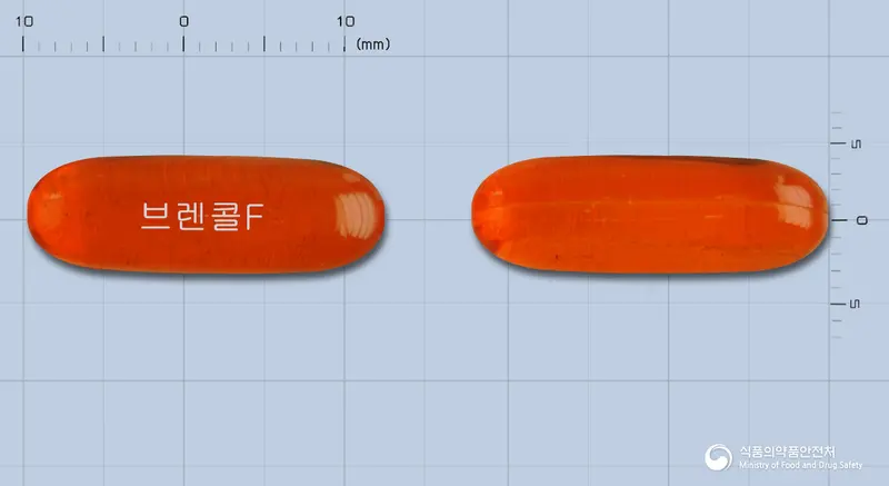 브렌콜에프연질캡슐 앞뒤 사진 (주황색·투명 캡슐, 각인 브렌콜F)