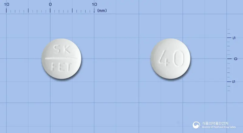 페브릭정40밀리그램(페북소스타트) 앞뒤 사진 (흰색 원형, 각인 SK FET / 40)