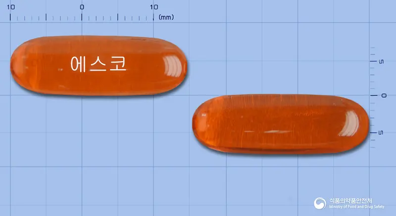 에스코연질캡슐 앞뒤 사진 (주황색·투명 캡슐, 각인 에스코)