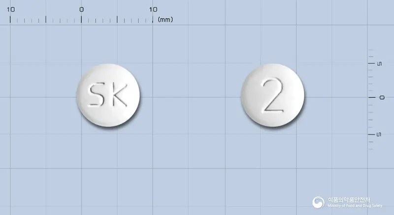 올메신정20밀리그램(올메사탄메독소밀) 앞뒤 사진 (흰색 원형, 각인 SK / 2)