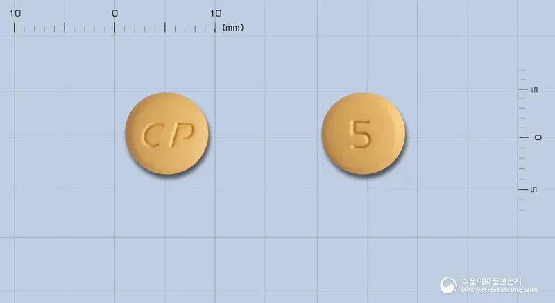 아모르탄정5/80mg 앞뒤 사진 (주황색 원형, 각인 CP / 5)