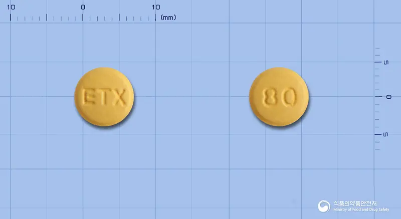 엑스페라정5/80밀리그램 앞뒤 사진 (주황색 원형, 각인 ETX / 80)