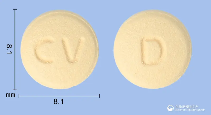 비스포지정5/80밀리그램(암로디핀베실산염, 발사르탄) 앞뒤 사진 (주황색 원형, 각인 CV / D)