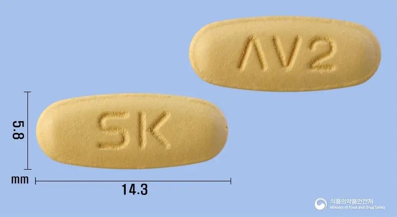 엑스패럴정5mg/160mg 앞뒤 사진 (주황색 타원형, 각인 SK / ΛV2)