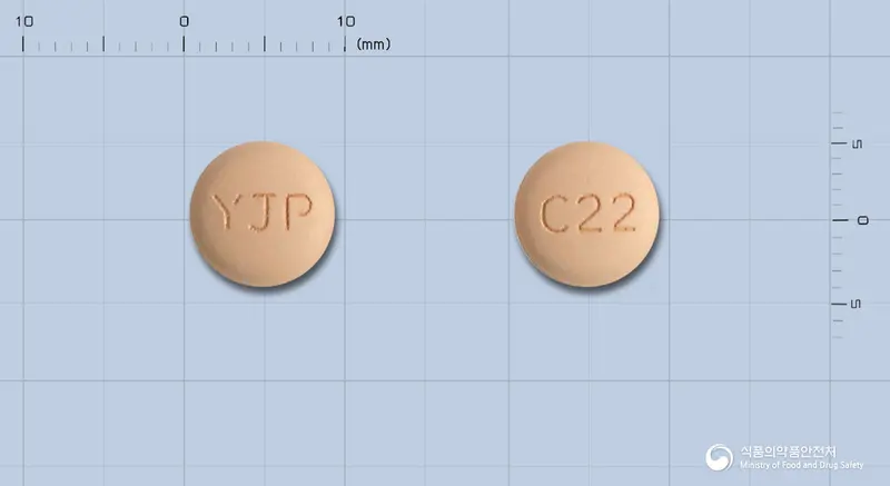 올메칸플러스정20/12.5밀리그램 앞뒤 사진 (주황색 원형, 각인 YJP / C22)