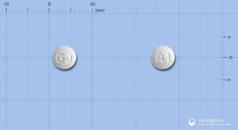 아토릭스정10mg(아토르바스타틴칼슘수화물) 앞뒤 사진 (흰색 원형, 각인 A1)