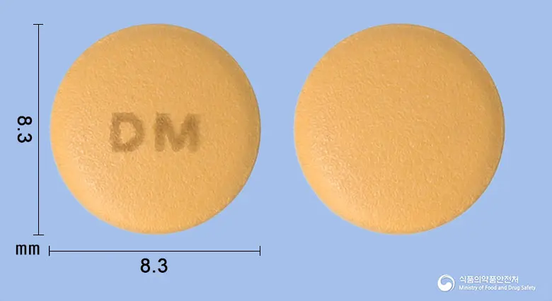 디스포지정5/80mg 앞뒤 사진 (주황색 원형, 각인 DM)