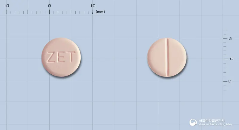 스토젠정(스트렙토키나제·스트렙토도르나제) 앞뒤 사진 (분홍색 원형, 각인 ZET)
