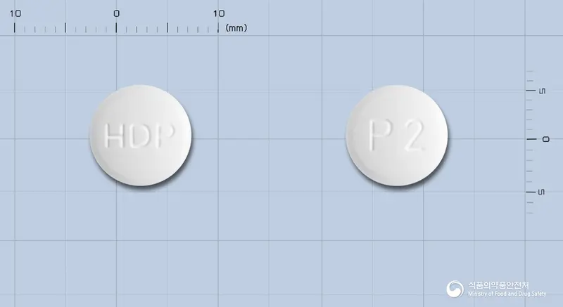 미라프서방정0.75밀리그램(프라미펙솔염산염일수화물) 앞뒤 사진 (흰색 원형, 각인 HDP / P2)