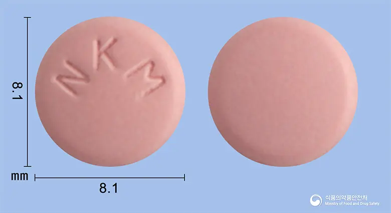 라딘큐정(라니티딘염산염) 앞뒤 사진 (분홍색 원형, 각인 NKM)