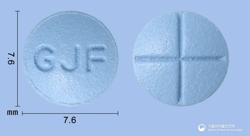 피나그렌정5mg(피나스테리드) 앞뒤 사진 (파란색 원형, 각인 GJF)
