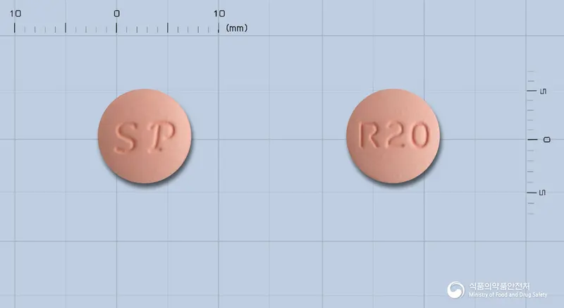 콜로스타정20밀리그램(로수바스타틴칼슘) 앞뒤 사진 (분홍색 원형, 각인 R20)