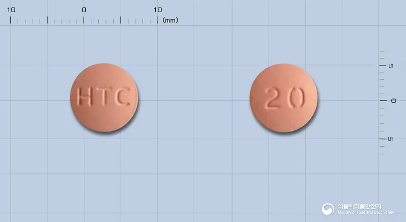 크레스바정20mg(로수바스타틴칼슘) 앞뒤 사진 (분홍색 원형, 각인 HTC / 20)