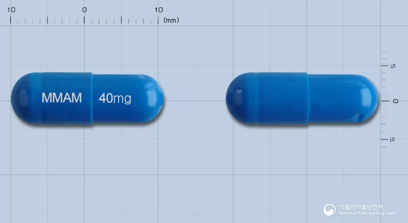 아트렉스캡슐40mg(아토목세틴염산염)(수출용) 앞뒤 사진 (파란색 캡슐, 각인 MMAM 40mg)