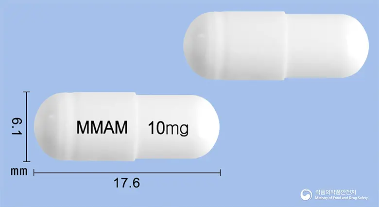 아트렉스캡슐10mg(아토목세틴염산염)(수출용) 앞뒤 사진 (흰색 캡슐, 각인 MMAM 10mg)