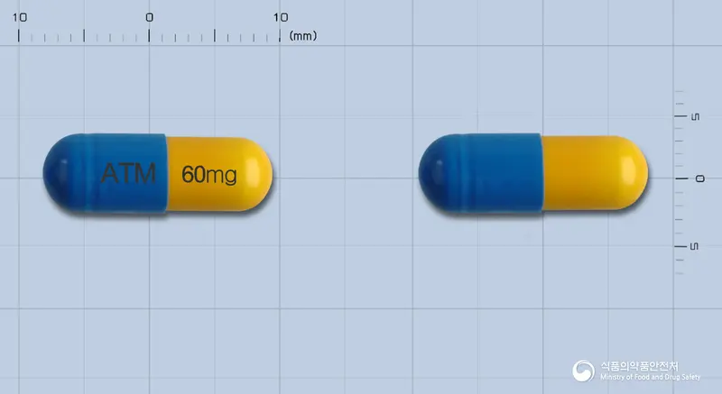 아토목신캡슐60밀리그램(아토목세틴염산염) 앞뒤 사진 (파란색 캡슐, 각인 ATM 60mg)