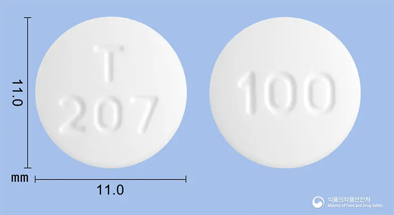 서튜러정100밀리그램(베다퀼린푸마르산염) 앞뒤 사진 (흰색 원형, 각인 T207 / 100)