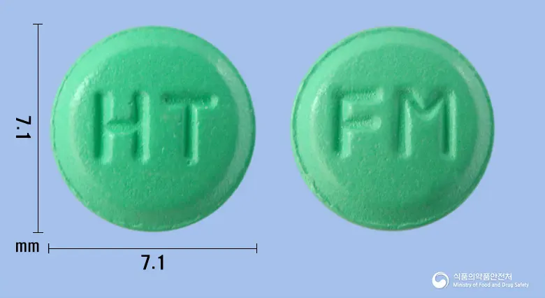 휴텍스파모티딘정20mg 앞뒤 사진 (초록색 원형, 각인 HT / FM)