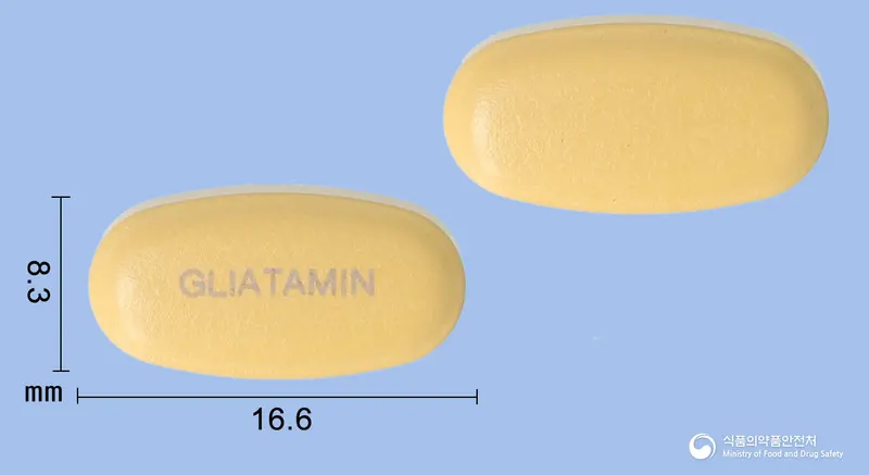 글리아타민정(콜린알포세레이트) 앞뒤 사진 (주황색 타원형, 각인 GLIATAMIN)