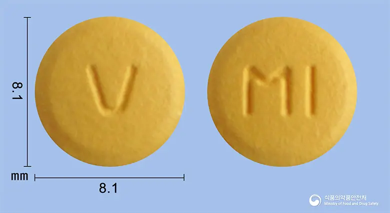 에스살탄정5/80mg(수출용) 앞뒤 사진 (주황색 원형, 각인 V / MI)