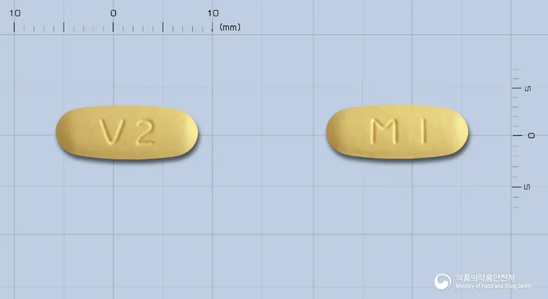 에스살탄정10/160mg(수출용) 앞뒤 사진 (노란색 타원형, 각인 V2 / MI)