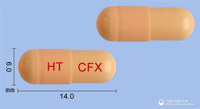 쎄팍심캡슐(세픽심수화물) 앞뒤 사진 (주황색 캡슐, 각인 HT CFX)