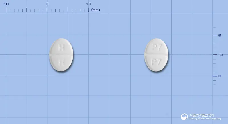 미라프정0.25밀리그램(프라미펙솔염산염일수화물) 앞뒤 사진 (흰색 타원형, 각인 H H / P7 P7)