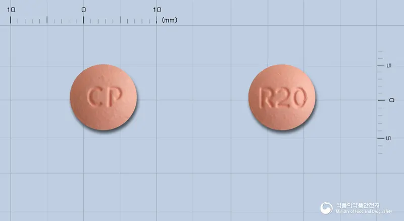 씨엠지로수바스타틴정20mg(로수바스타틴칼슘) 앞뒤 사진 (분홍색 원형, 각인 CP / R20)