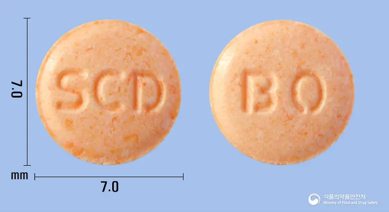 에스녹틸정40mg(옥틸로늄브롬화물) 앞뒤 사진 (분홍색 원형, 각인 SCD / BO)
