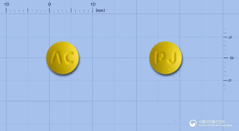 피아이졸정20mg(라베프라졸나트륨) 앞뒤 사진 (노란색 원형, 각인 ΛC / PJ)