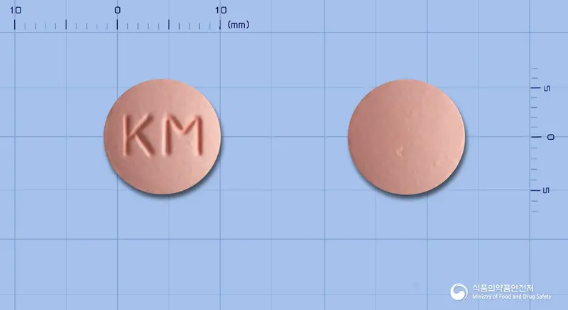 알파리포정(티옥트산) 앞뒤 사진 (분홍색 원형, 각인 KM)