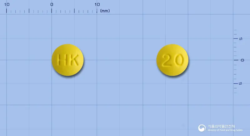 라베파정20밀리그램(라베프라졸나트륨) 앞뒤 사진 (노란색 원형, 각인 HK / 20)