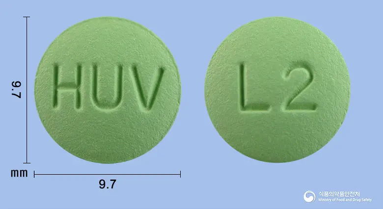 휴메틴정(시메티딘) 앞뒤 사진 (연두색 원형, 각인 HUV / L2)