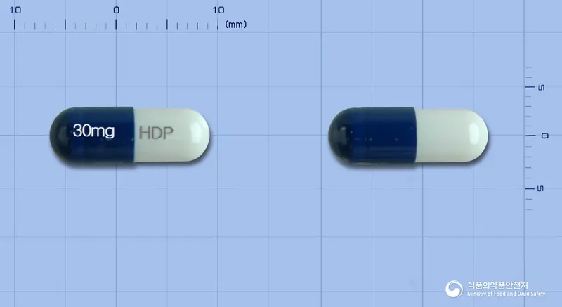 투발타캡슐30밀리그램(둘록세틴염산염) 앞뒤 사진 (파란색 캡슐, 각인 30mg HDP)