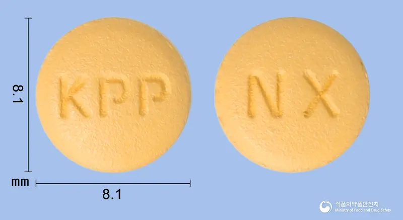 엑스디핀정5/80밀리그램 앞뒤 사진 (주황색 원형, 각인 KPP / NX)
