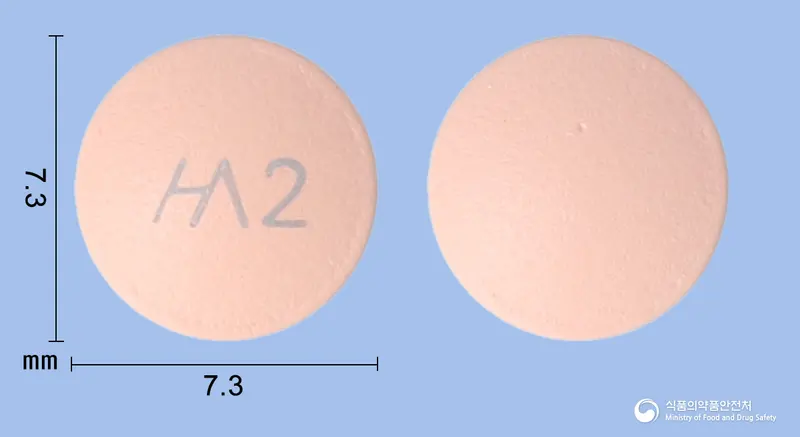 한시움정20mg(에스오메프라졸마그네슘삼수화물) 앞뒤 사진 (분홍색 원형, 각인 2)