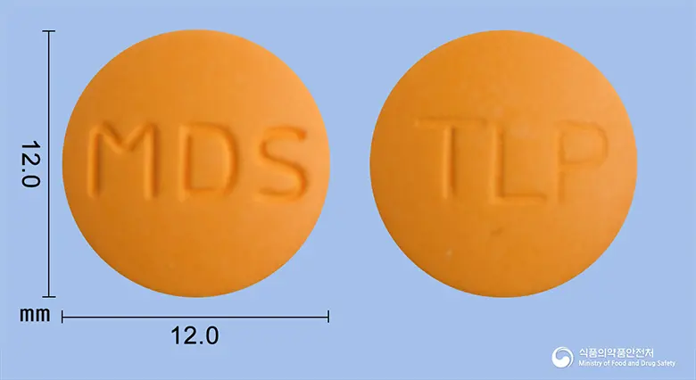 플루메정(탈니플루메이트) 앞뒤 사진 (주황색 원형, 각인 MDS / TLP)