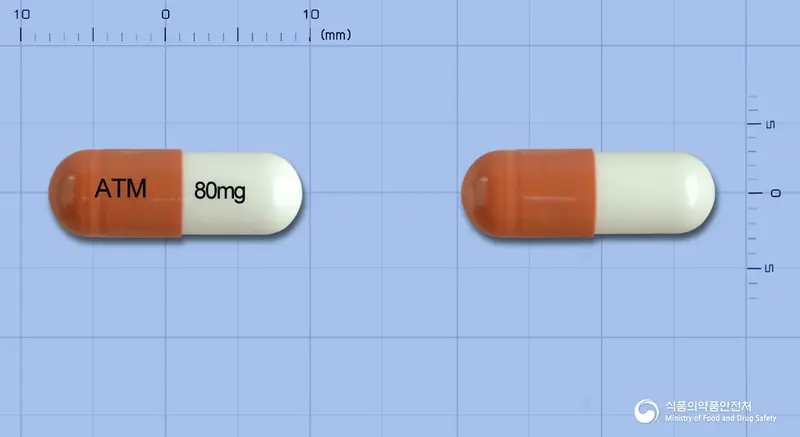 아토목신캡슐80밀리그램(아토목세틴염산염) 앞뒤 사진 (갈색 캡슐, 각인 ATM 80mg)