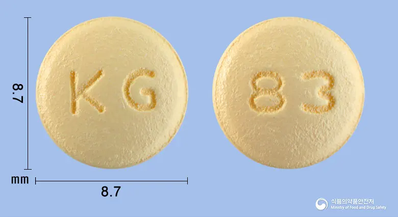 도네세트정10mg(도네페질염산염수화물) 앞뒤 사진 (주황색 원형, 각인 KG / 83)
