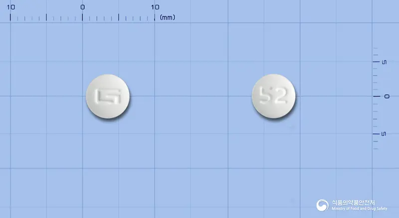 동광미녹시딜정5mg 앞뒤 사진 (흰색 원형, 각인 52)