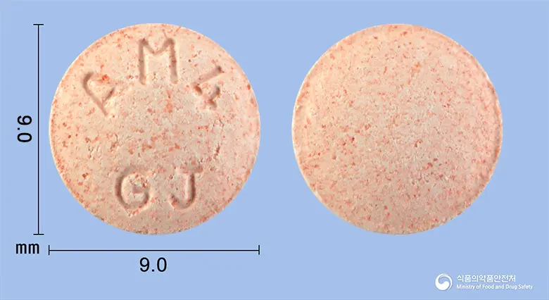 알러몬트츄정4mg(몬테루카스트나트륨) 앞뒤 사진 (분홍색 원형, 각인 AM4GJ)