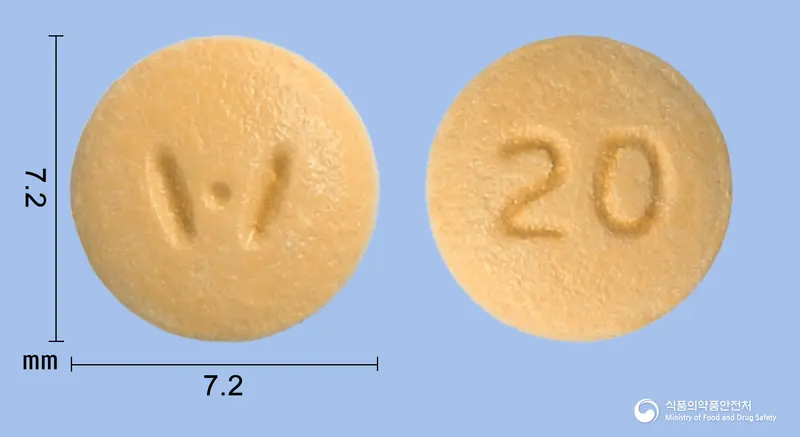 라베휴정20mg(라베프라졸나트륨) 앞뒤 사진 (노란색 원형, 각인 20)