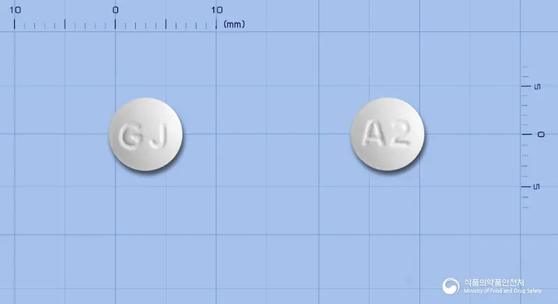 아토릭스정20mg(아토르바스타틴칼슘수화물) 앞뒤 사진 (흰색 원형, 각인 A2)