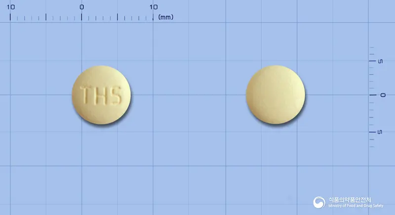 올메디퀄정5/40밀리그램 앞뒤 사진 (노란색 원형, 각인 TH5)
